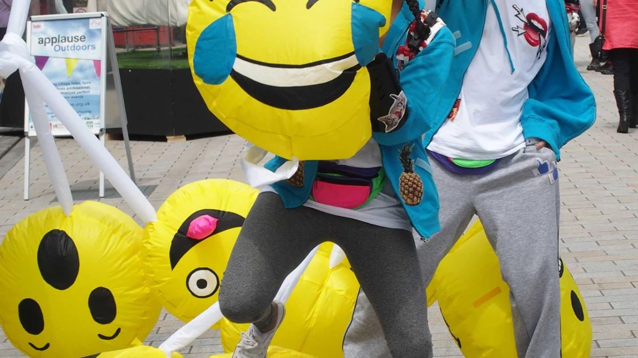 Close-up of emoji costume performers